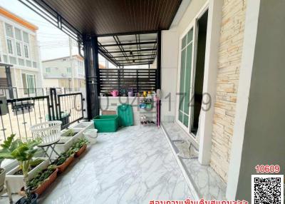 Spacious balcony with marble flooring and protective railing
