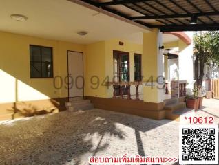 Front exterior of a house with a tiled porch and ample sunlight