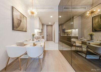 Modern dining room with adjacent kitchen view