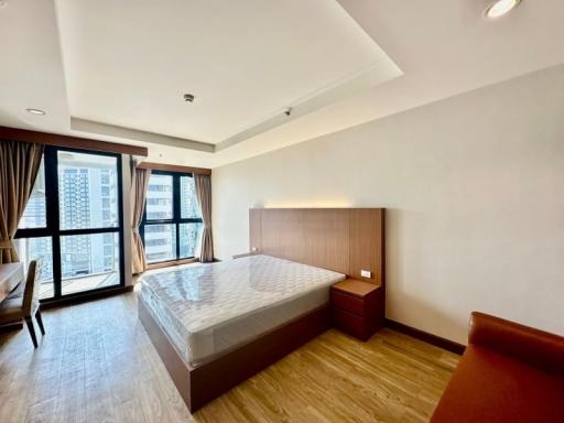 Spacious bedroom with large bed and ample natural light