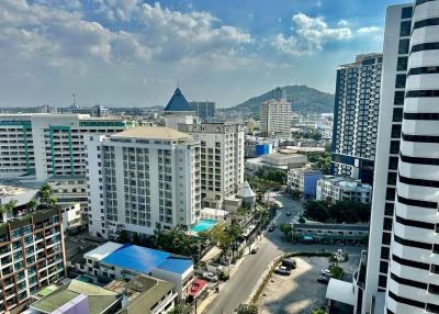 Expansive city view from a high-rise apartment balcony