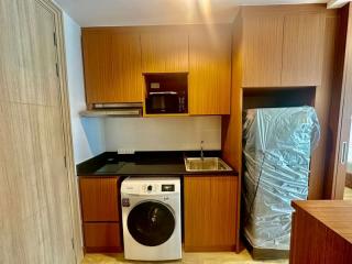 Modern kitchen with wood cabinets and new appliances