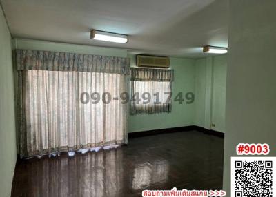 Spacious empty room with air conditioning and large windows