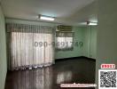 Spacious empty room with air conditioning and large windows