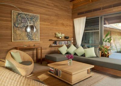 Cozy wooden living room with comfortable seating and natural light