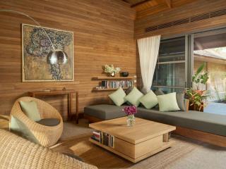 Cozy wooden living room with comfortable seating and natural light