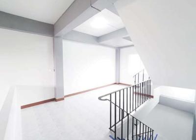 Bright and modern staircase area with white walls