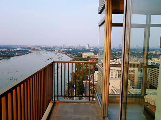 Spacious balcony overlooking a river with an expansive view