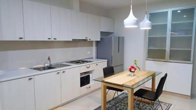 Modern kitchen with stainless steel appliances and a dining area