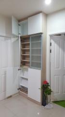 Built-in white storage cabinet in a home