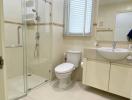 Modern bathroom interior with glass shower and tiled flooring