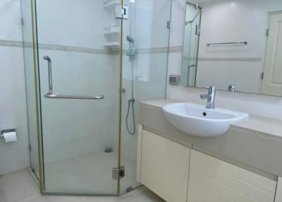 Modern bathroom with glass shower and white vanity