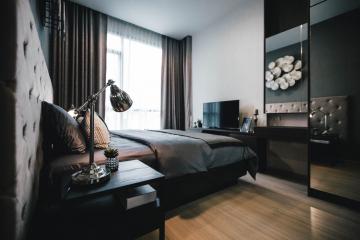 Elegantly decorated modern bedroom with a comfortable bed and stylish interior