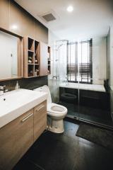 Modern bathroom interior with clean lines and wooden accents