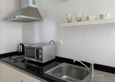 Modern kitchen with stainless steel appliances and white cabinetry