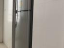 Modern stainless steel refrigerator in a bright kitchen