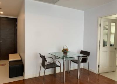 Minimalist dining area with glass table and modern chairs