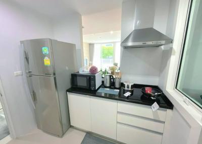 Modern kitchen with stainless steel appliances and white cabinetry