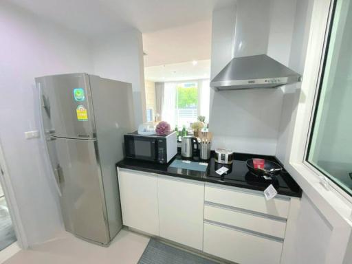 Modern kitchen with stainless steel appliances and white cabinetry