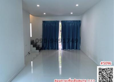 Spacious and Bright Unfurnished Living Room with Large Windows and Glossy Floor