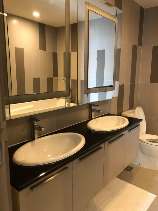 Modern bathroom with double vanity and large mirror