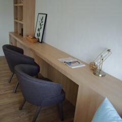 Contemporary study area with stylish chairs and wooden desk