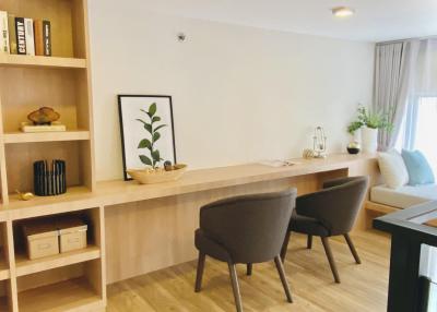 Modern living room with clean design and ample shelving