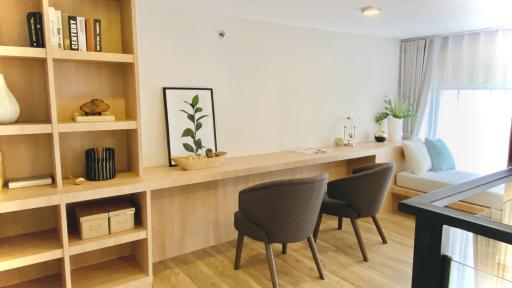 Modern living room with clean design and ample shelving