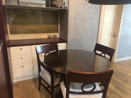 Modern dining room interior with round table and chairs