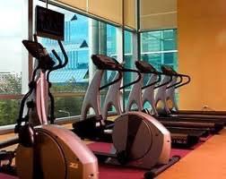 In-house gym with cardio equipment and city views