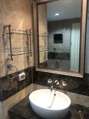 Bathroom with modern fixtures and marble countertop