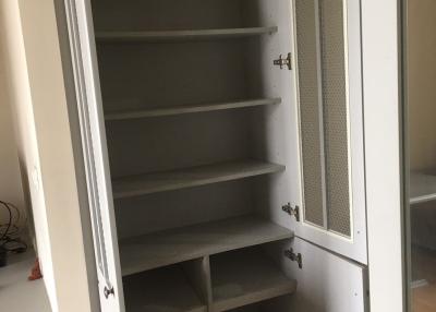 Empty white shelving unit in a home indicating storage space