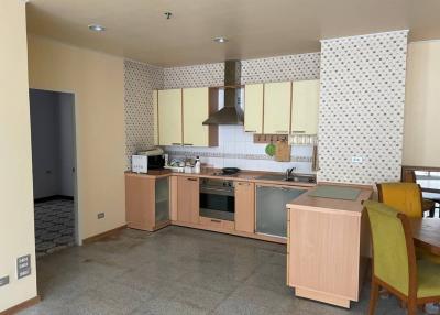 Spacious kitchen with modern amenities and a dining area