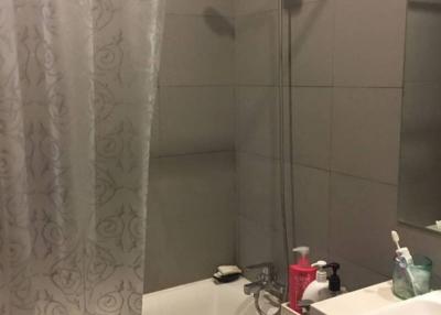 Contemporary bathroom with bathtub and neutral tile