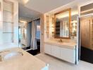 Modern bathroom interior with marble countertops and large mirror
