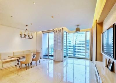 Spacious living room with dining area and balcony access in a modern apartment