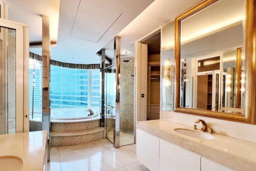 Luxurious bathroom with marble finishes and modern lighting