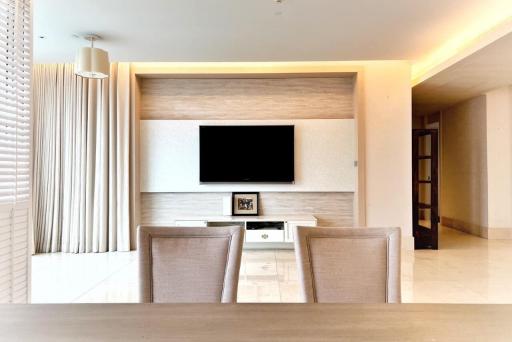 Modern living room interior with television and dining area