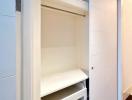 Modern built-in closet with open drawers and shelves