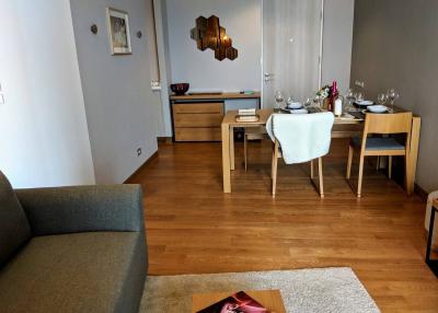 Modern living room with dining area and hardwood floors