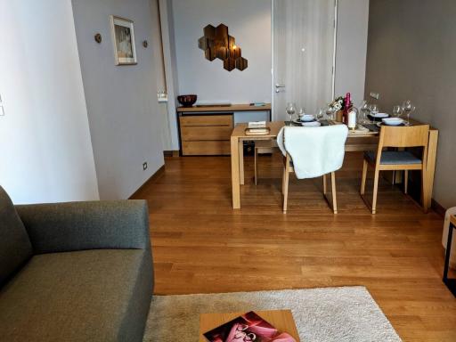 Modern living room with dining area and hardwood floors