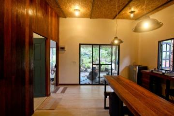 Spacious living area with natural light and wood accents