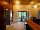 Spacious living area with natural light and wood accents