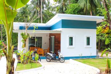 Cozy tropical house with a spacious front porch and scooter parking