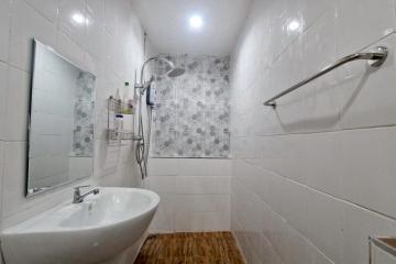 Modern bathroom interior with flower patterned tiles