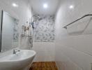 Modern bathroom interior with flower patterned tiles