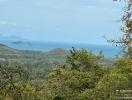 Panoramic sea view from the property surrounded by lush greenery