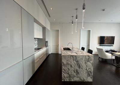 Modern kitchen with marble island and integrated appliances