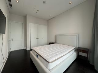 Spacious bedroom with contemporary design, large bed, and wooden flooring