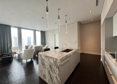 Modern kitchen interior with marble finishes and open-plan layout